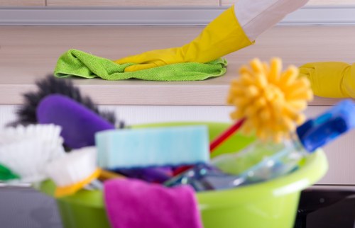 Professional carpets cleaner in Harrow working on a living room carpet